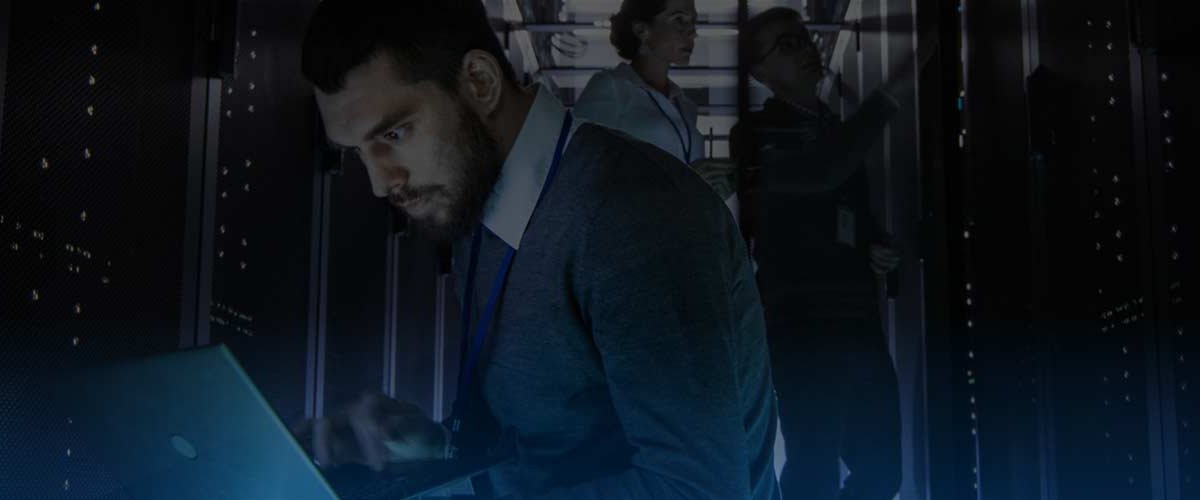 IT professionals in large server room