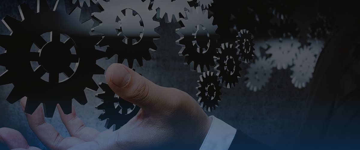 Series of metal gears floating in front of businessman