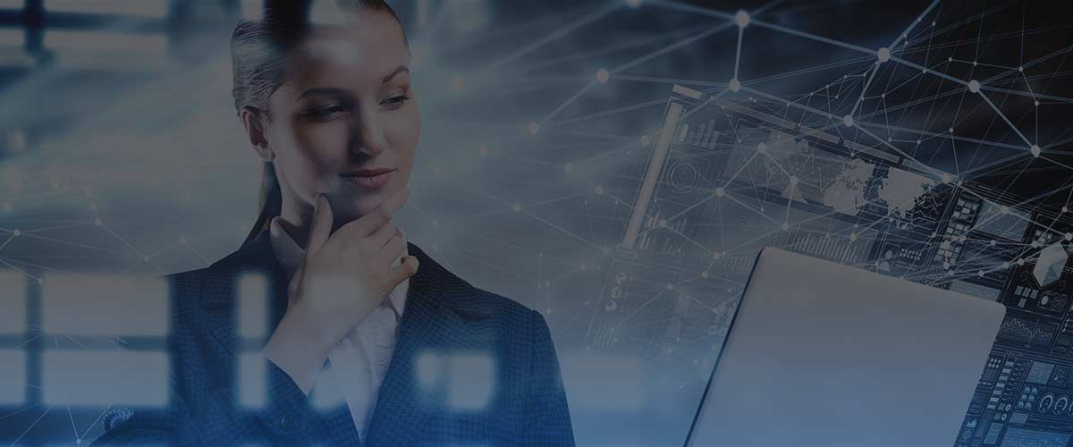 Business woman looking at laptop with connected data graphics superimposed