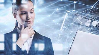 Businesswoman holding laptop with data graphics superimposed