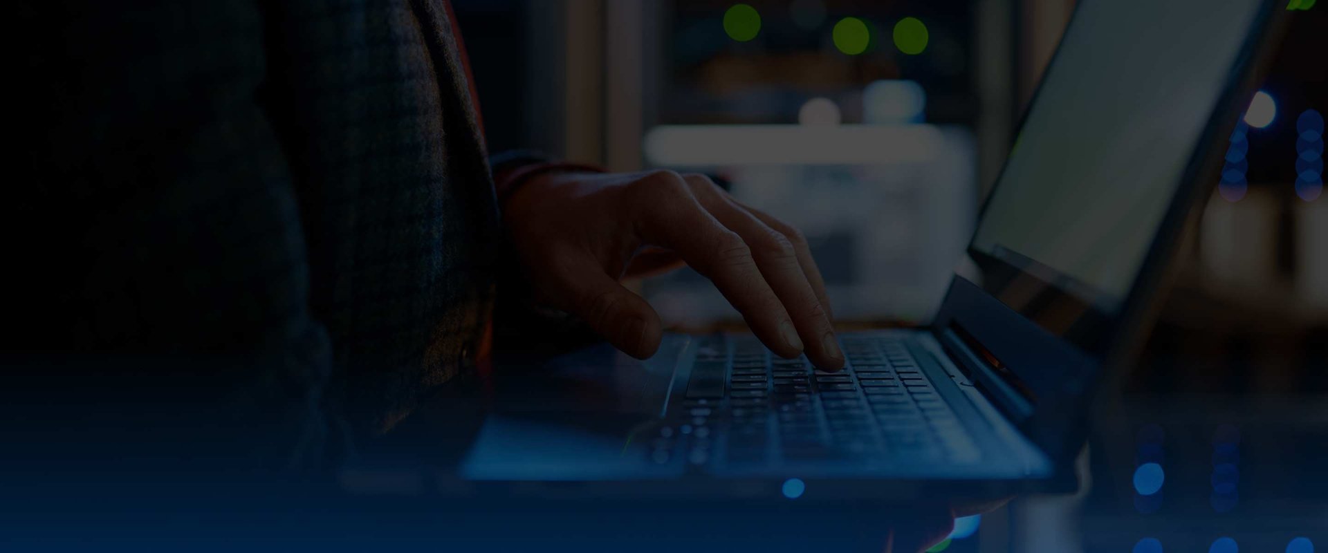 IT technician checking the servers vitals using laptop
