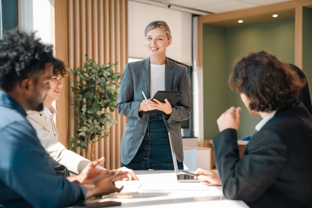 Business Professional Leading Team Presentation in Modern Office