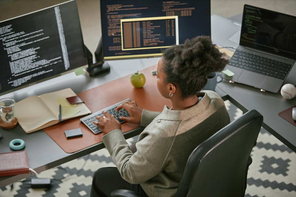African American woman working on computer at a desk